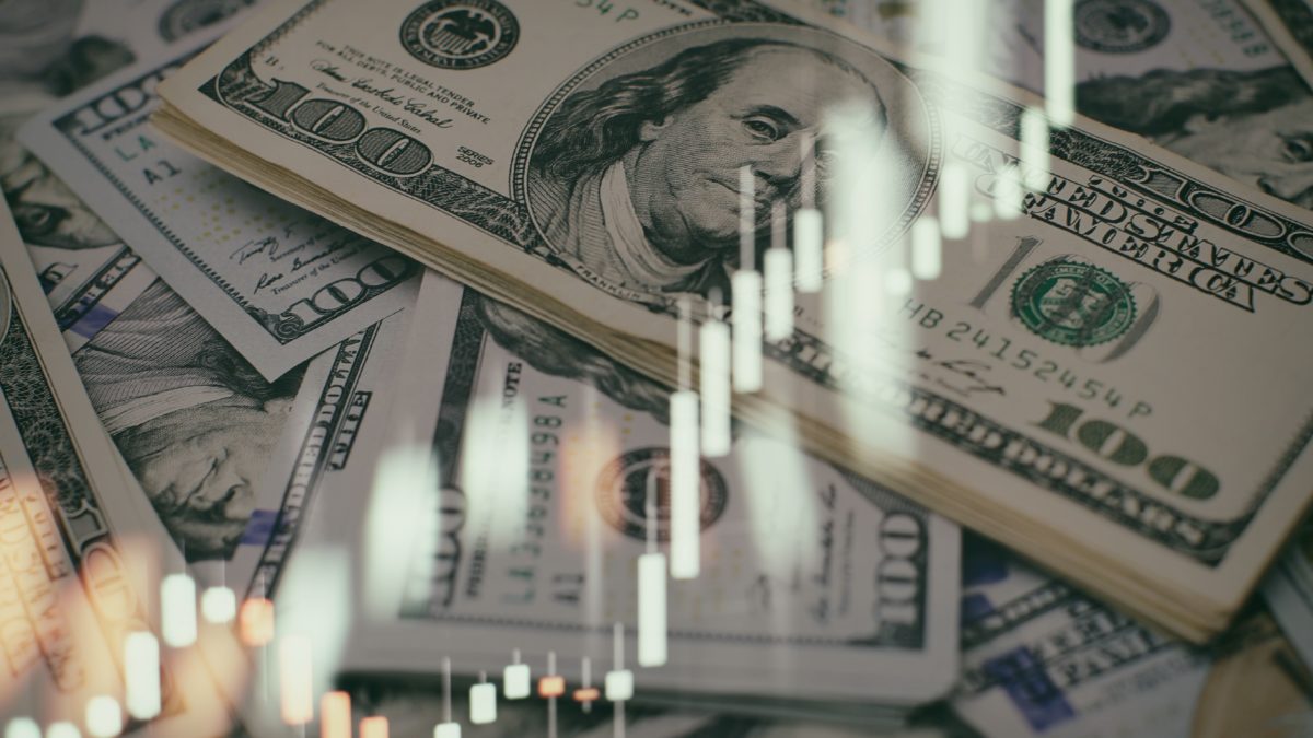 USD banknotes and investment graph