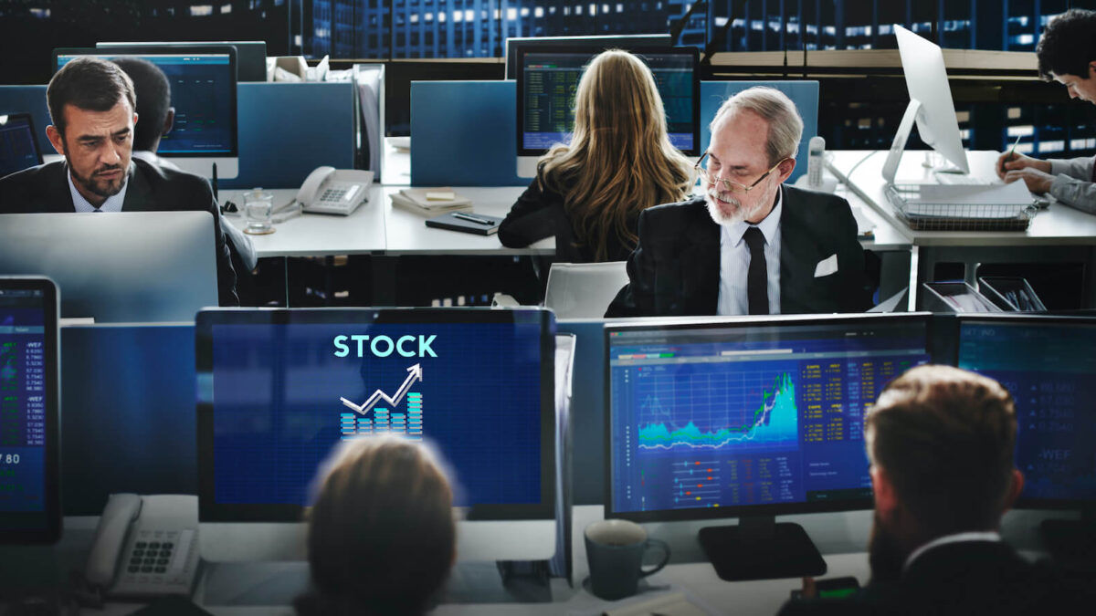 Are Investors and Traders Missing Out on Crucial Market Sentiment Data? - Stockgeist Traders analyzing stock market sentiment data